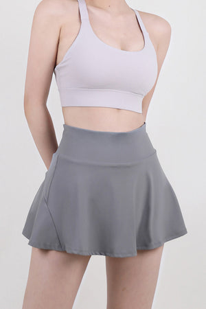 Sculpted flared skort in dark gray, breathable activewear with a comfortable fit.