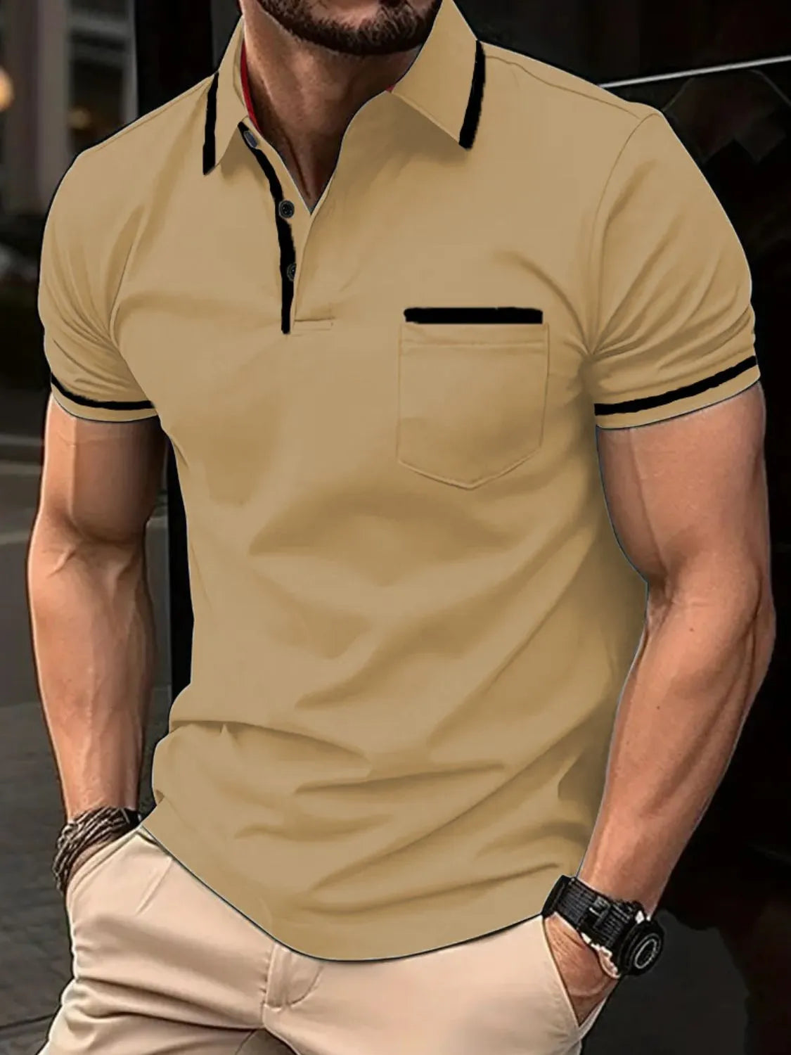 Tan short sleeve polo shirt with black trim on collar, pocket, and sleeves.