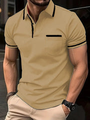 Tan short sleeve polo shirt with black trim on collar, pocket, and sleeves.