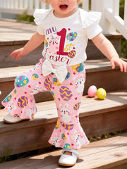 Baby Easter outfit with white ruffled sleeve top and pink bunny & egg print bell bottoms.
