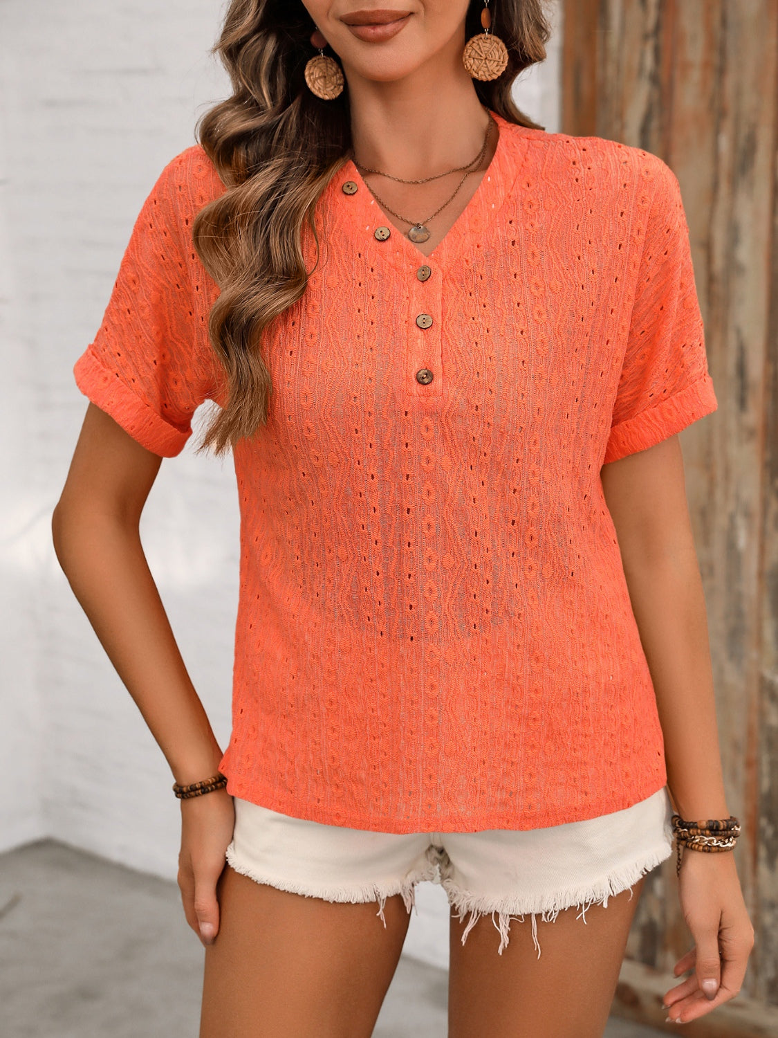 Eyelet Henley relaxed fit blouse in black, white, or orange-red.