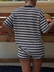 Black striped relaxed fit two-piece set with short sleeves and shorts.