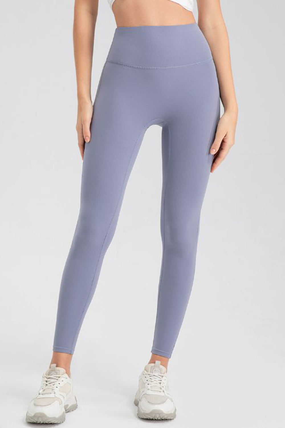 Blue Purple high-waist performance leggings with sculpting seams.