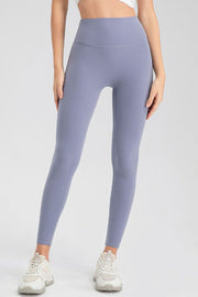 Blue Purple high-waist performance leggings with sculpting seams.