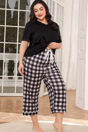 Black V-neck tee with heart check lounge pants featuring a drawstring waist