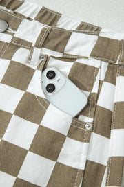 Chic checkered denim barrel pants in brown and white with a phone in the pocket.