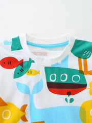 White cotton toddler t-shirt with a colorful marine print featuring boats and fish.