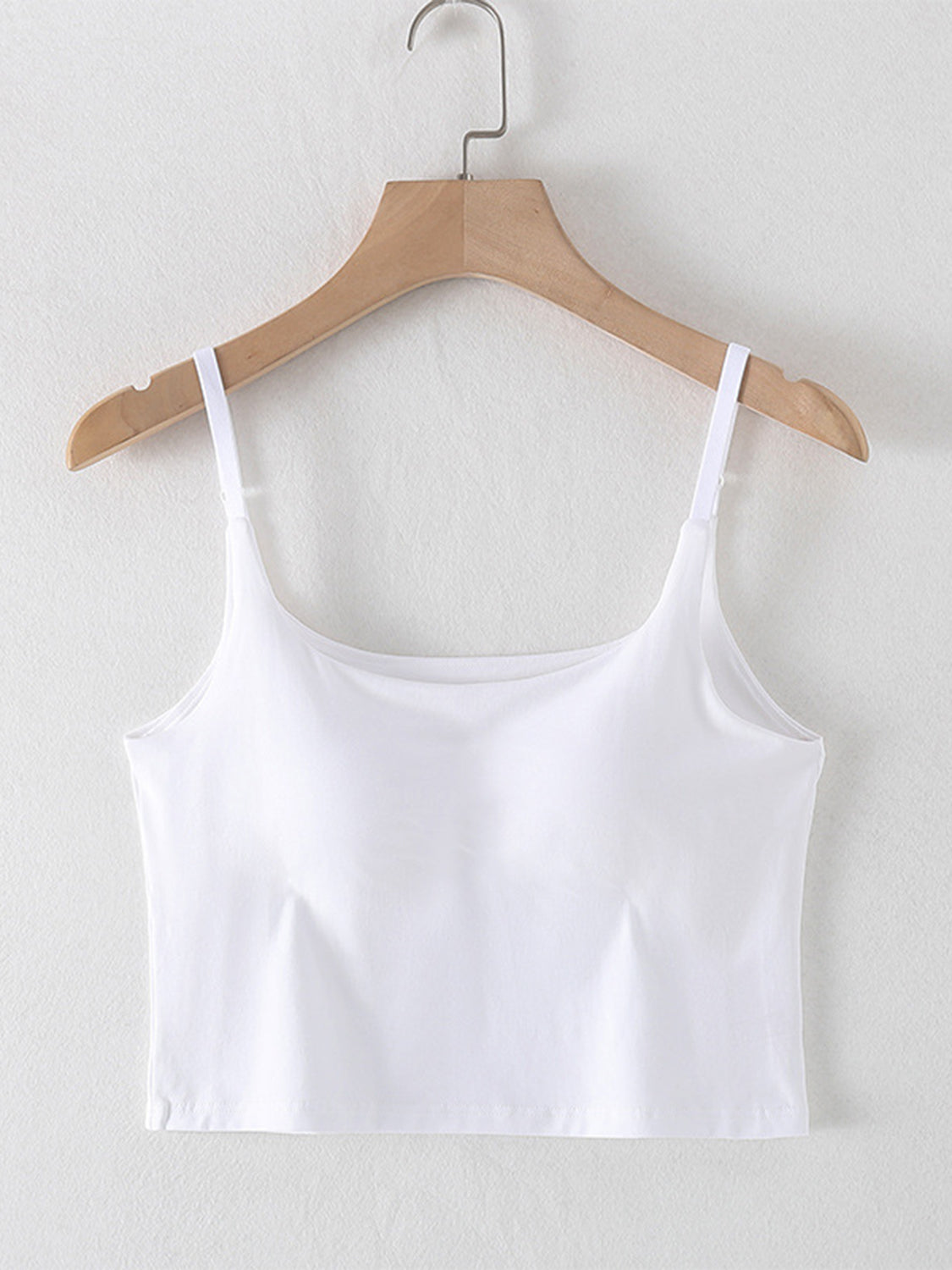 White built-in bustier crop camisole with adjustable straps and square neckline.