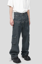 Panelled dark wash denim cargo pants with multiple pockets and a relaxed fit.