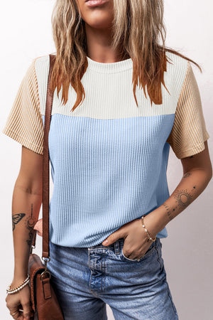 Panelled ribbed tee with textured sleeves in white, light blue, and tan.