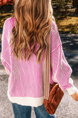 Hot Pink and white striped drop-shoulder knit sweater with a crew neck and ribbed hem.