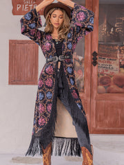 Bohemian floral duster with fringe, bell sleeves, and multicolor pattern.