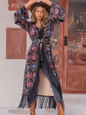 Bohemian floral duster with fringe, bell sleeves, and multicolor pattern.