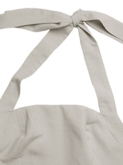Halter neck maxi dress in beige with tie detail.