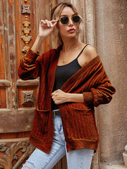 Brown textured pocket cardigan with ribbed detail and open front.