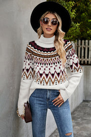 Geometric knit turtleneck sweater in cream with burgundy, brown, and black pattern.