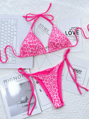 Hot Pink leopard print tie-side bikini set with triangle cups and string bikini bottoms.