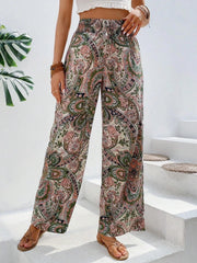 Paisley palazzo trousers with drawstring waist in multicolor, featuring a wide leg and boho print.