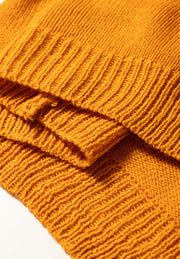Textured acrylic bobble cardigan in caramel with ribbed knit details.