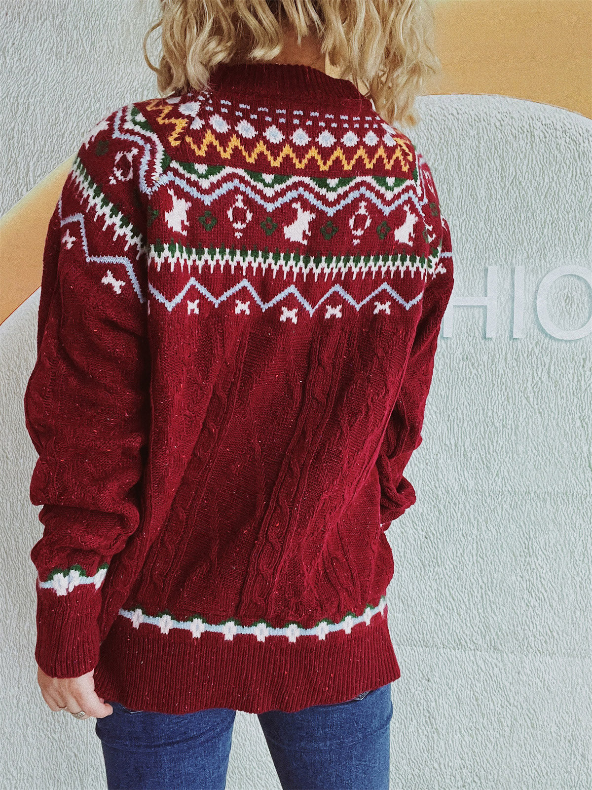 Burgundy cable knit turtleneck sweater with Fair Isle pattern and ribbed cuffs and hem.