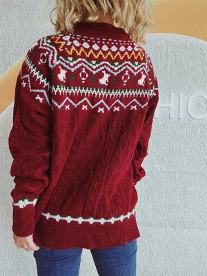 Burgundy cable knit turtleneck sweater with Fair Isle pattern and ribbed cuffs and hem.