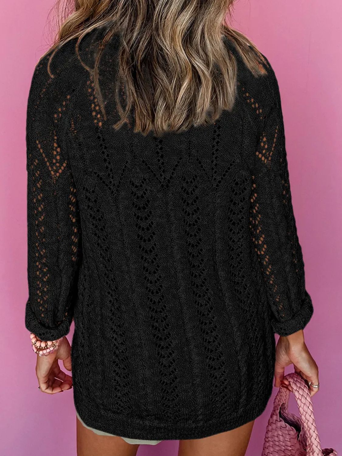 Black openwork chevron knit cardigan with long sleeves and a relaxed fit.