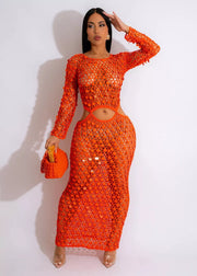 Orange mesh cutout maxi dress with sequin details and long sleeves.