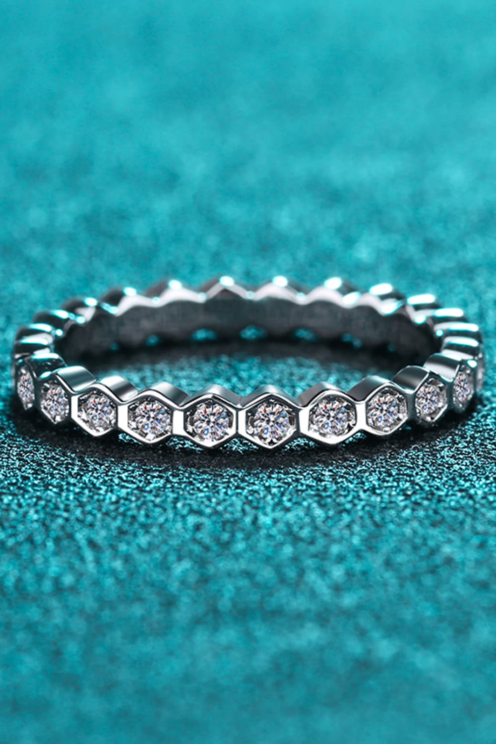 Silver eternity ring with hexagon pattern and clear stones