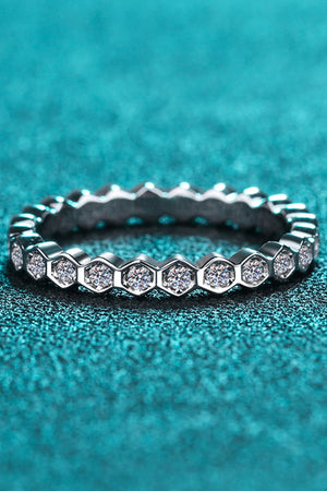 Silver eternity ring with hexagon pattern and clear stones