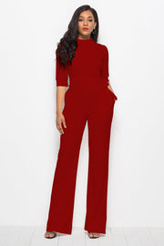 Deep Red high-neck belted palazzo jumpsuit with 3/4 sleeves and wide legs.