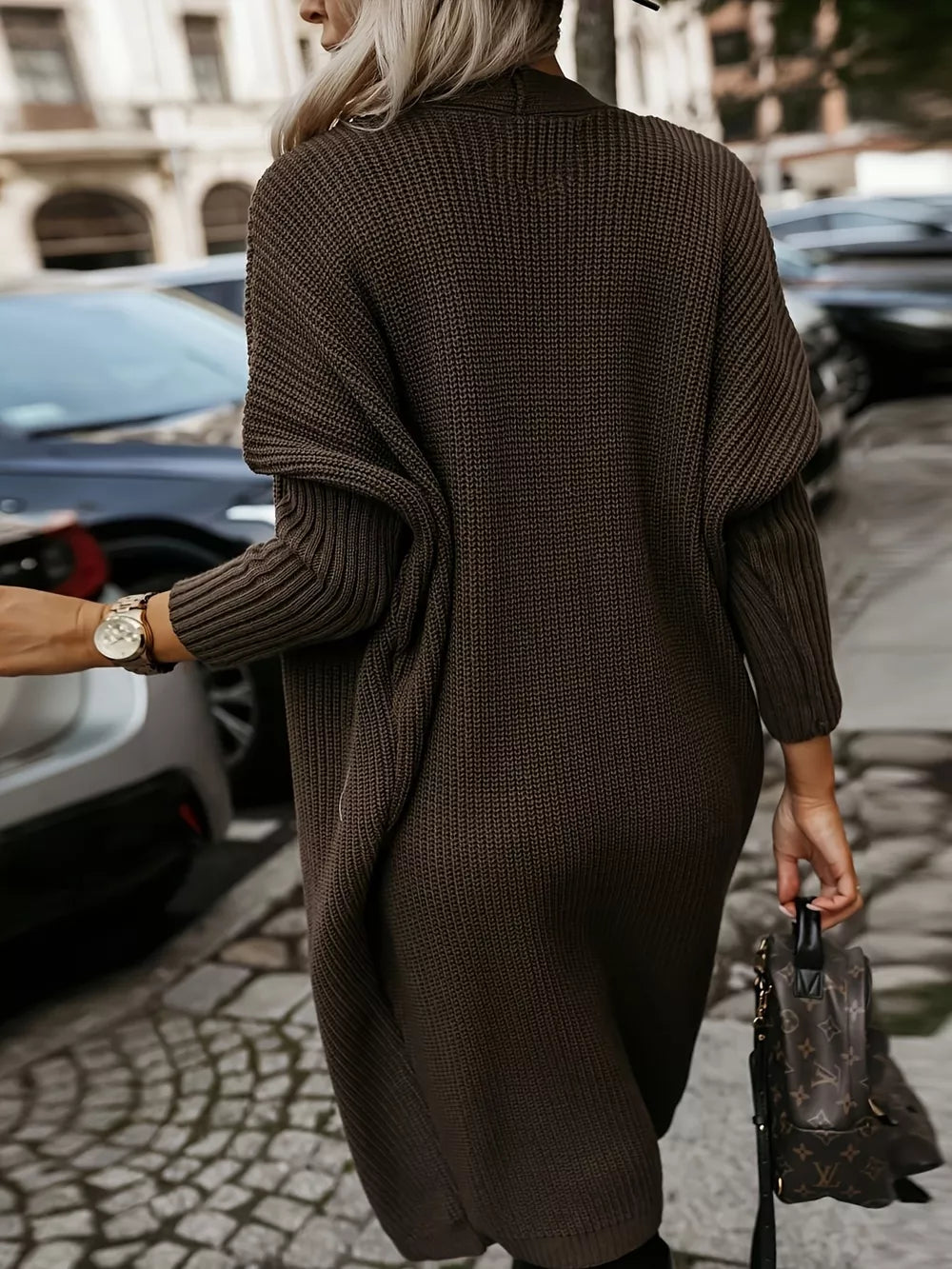 Brown ribbed texture longline knit cardigan with open front and long sleeves.
