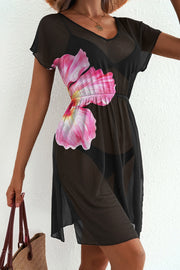 Black sheer V-neck beach cover-up with pink floral print and short sleeves.