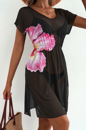 Black sheer V-neck beach cover-up with pink floral print and short sleeves.