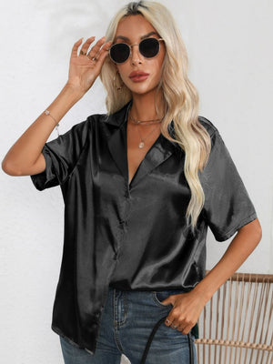 Black satin tie-front collared shirt with short sleeves and button front.