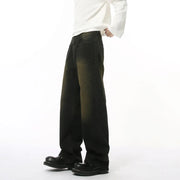 Dark wash distressed denim jeans with a relaxed fit and faded details.