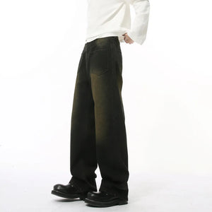 Dark wash distressed denim jeans with a relaxed fit and faded details.