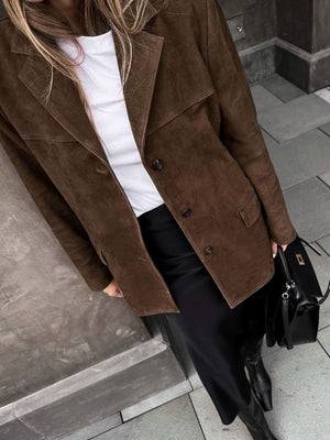 Brown suede blazer with structured shoulders, buttoned front, and notched lapels.