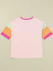 Colorblock tee in watermelon pink with colorblocked sleeves in orange, light green, and pink.
