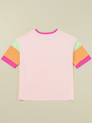 Colorblock tee in watermelon pink with colorblocked sleeves in orange, light green, and pink.