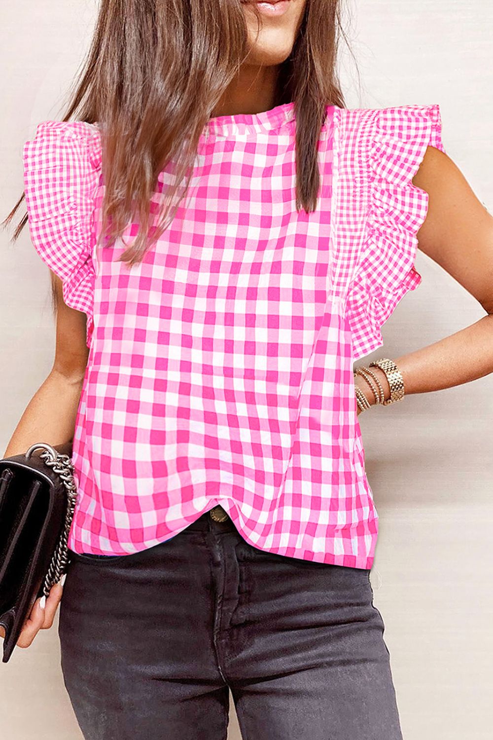 Fuchsia pink gingham blouse with ruffle sleeves and mock neckline.