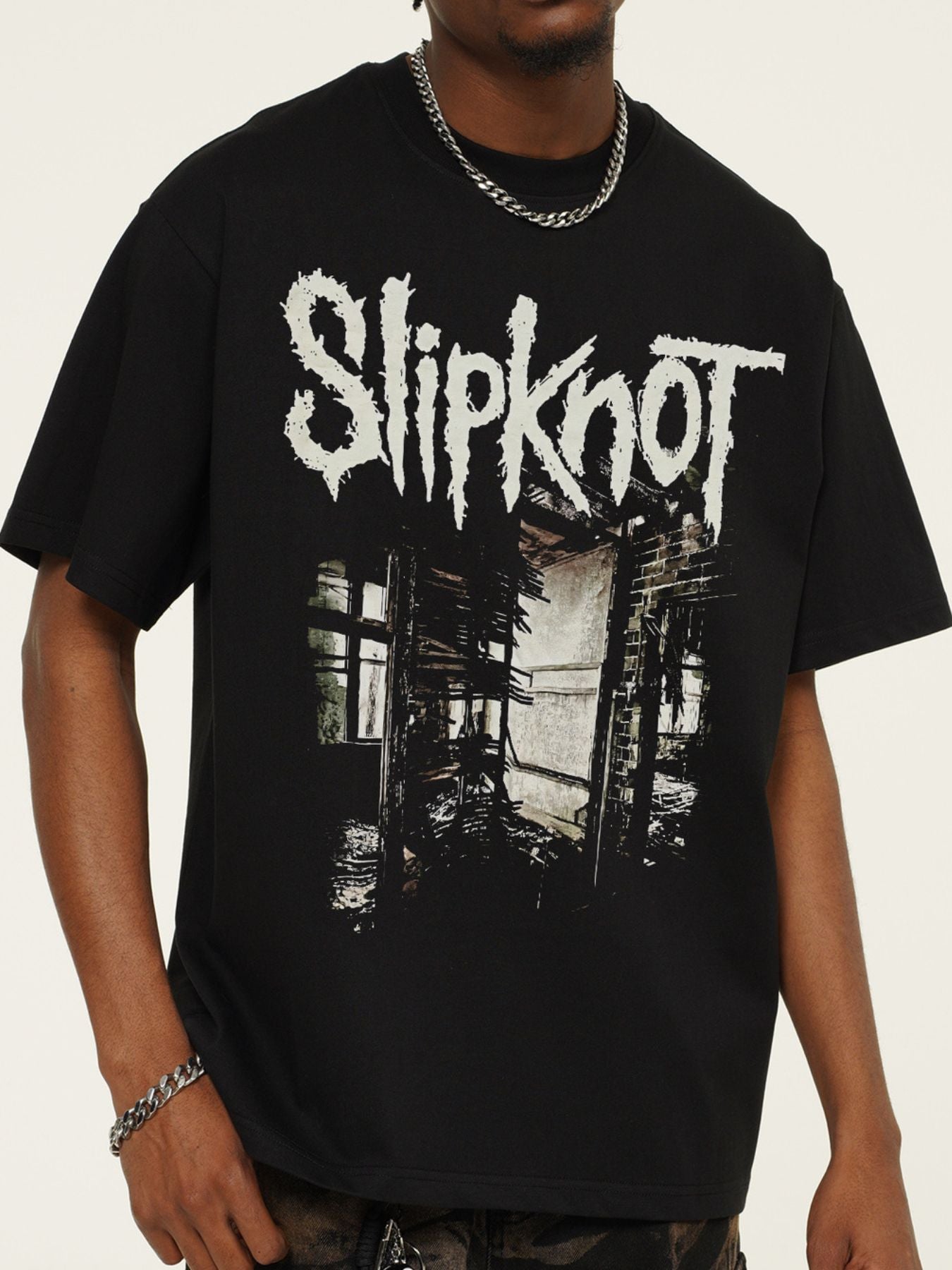 Men's black crew neck cotton t-shirt with distressed graphic print.