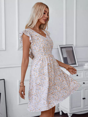 Ditsy floral mini dress with ruffled sleeves and V-neckline.