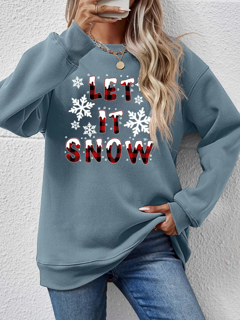 Misty Blue crewneck sweatshirt with "Let It Snow" graphic and snowflakes.