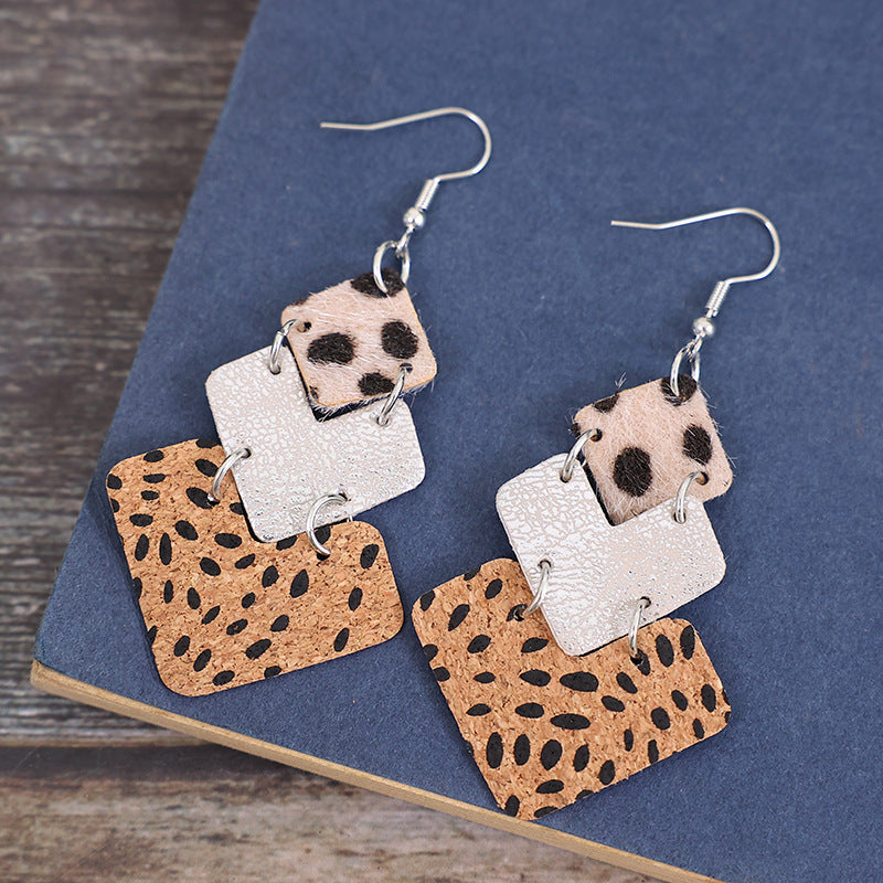 Textured leopard print drop earrings with tan and silver squares.