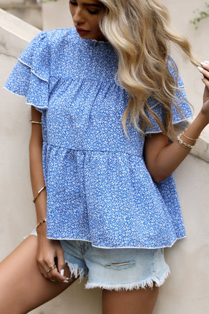 Sky blue floral peplum blouse with ruffled yoke and short flutter sleeves.