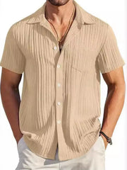Khaki textured pleated resort shirt with short sleeves and button front.