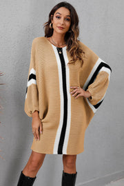 Oversized knit dress in Khaki with vertical black and white stripes and striped sleeves.