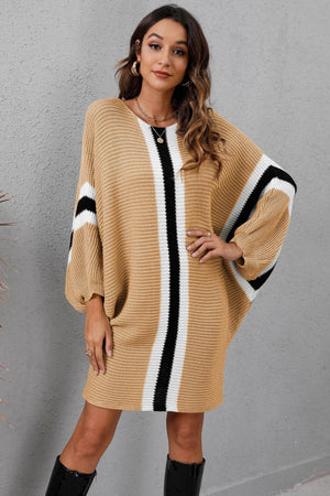 Oversized knit dress in Khaki with vertical black and white stripes and striped sleeves.