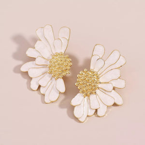 Textured gold flower stud earrings in white with gold accents.