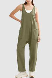 Relaxed fit jumpsuit in Matcha Green with oversized pockets and a V-neck.